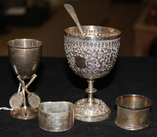 A silver tennis egg cuo, napkin ring, etc.